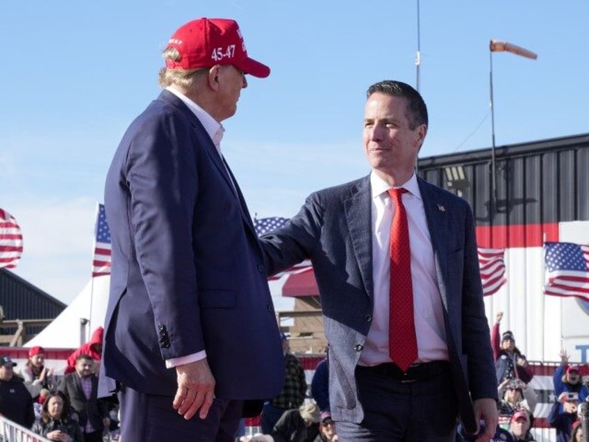 Republican presidential candidate and former President Donald Trump, left, embraces Senate