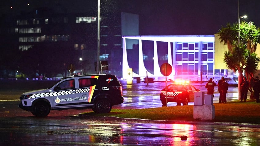 Police vehicles in front of Brazilian Supreme Court