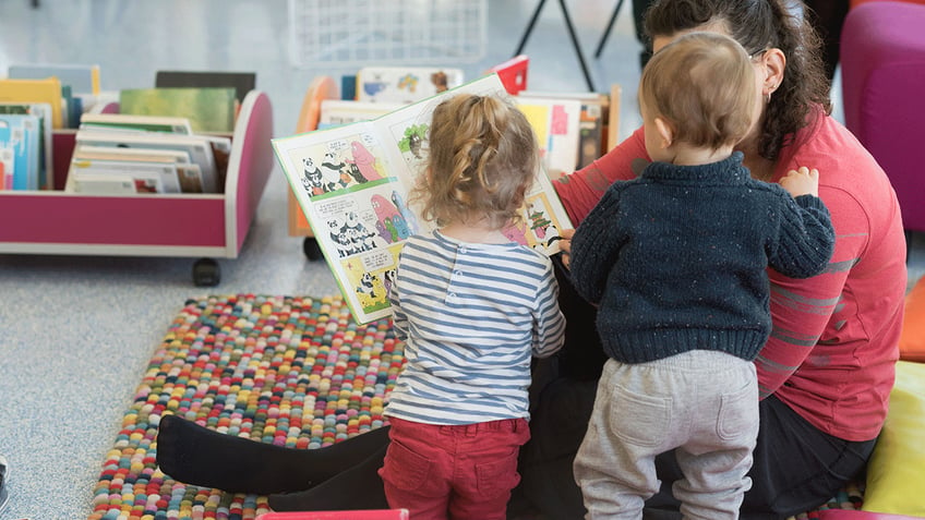 Mother reading to her children