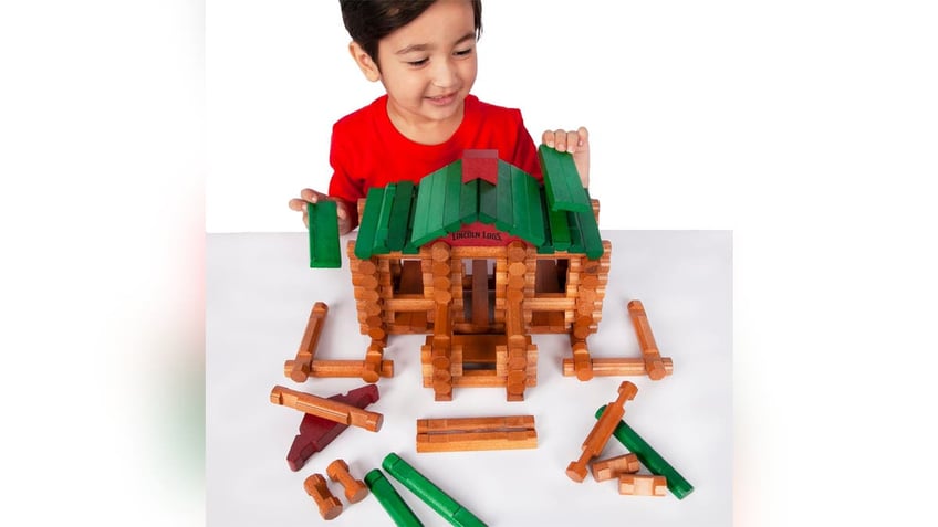 Lincoln Logs are a time-tested toy that teaches motor skills. 