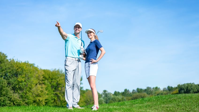 A couple out on the golf course