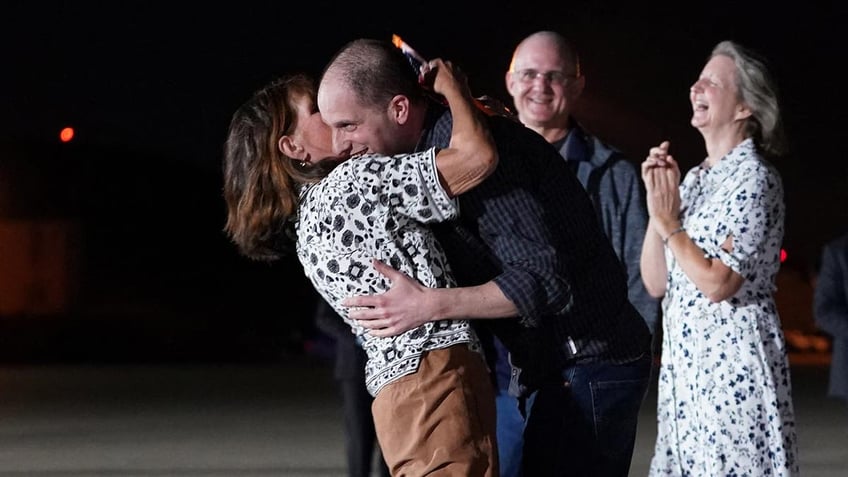 Evan Gershkovic hugging his mother