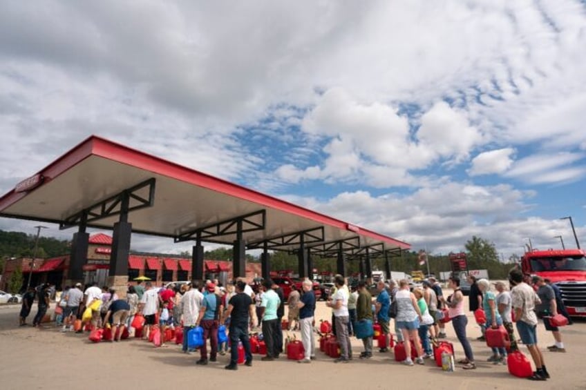 People wait in line for gasoline in the aftermath of Hurricane Helene on September 29, 202