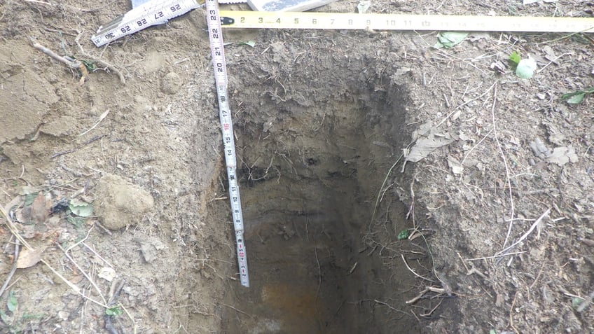 A cache pit used by an indigenous people in Alaska to store food measured about 3-and-a-half feet deep.