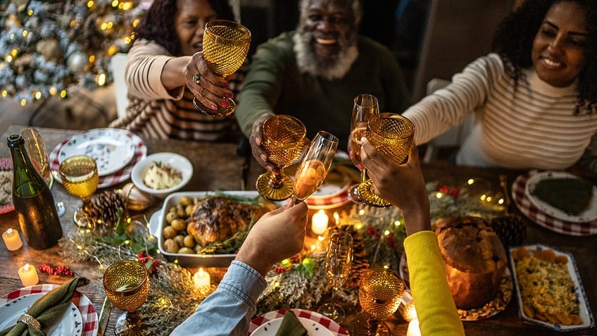 Family toasting around Christmas table