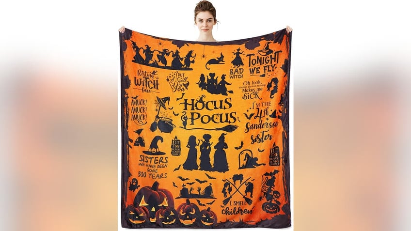 Snuggle up under a cozy Halloween-themed blanket.