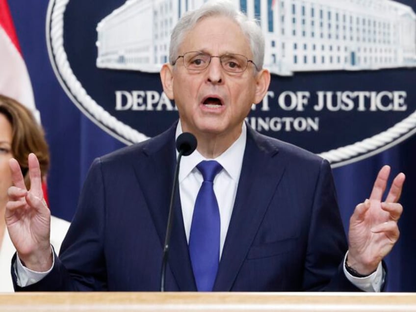 WASHINGTON, DC - AUGUST 23: U.S. Attorney General Merrick Garland (C) speaks alongside U.S