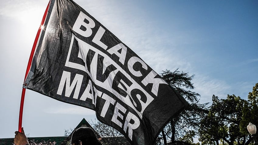 Protester waves Black Lives Matter flag in Los Angeles