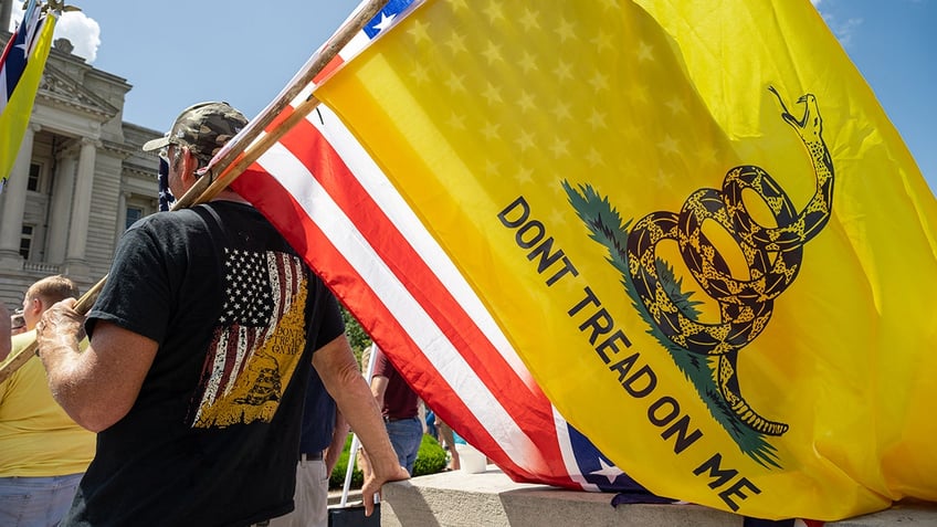 12 year old boy booted from class over gadsden flag patch on backpack origins with slavery