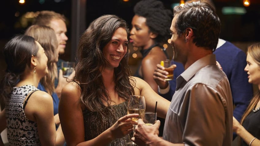 Couple speaks during a party