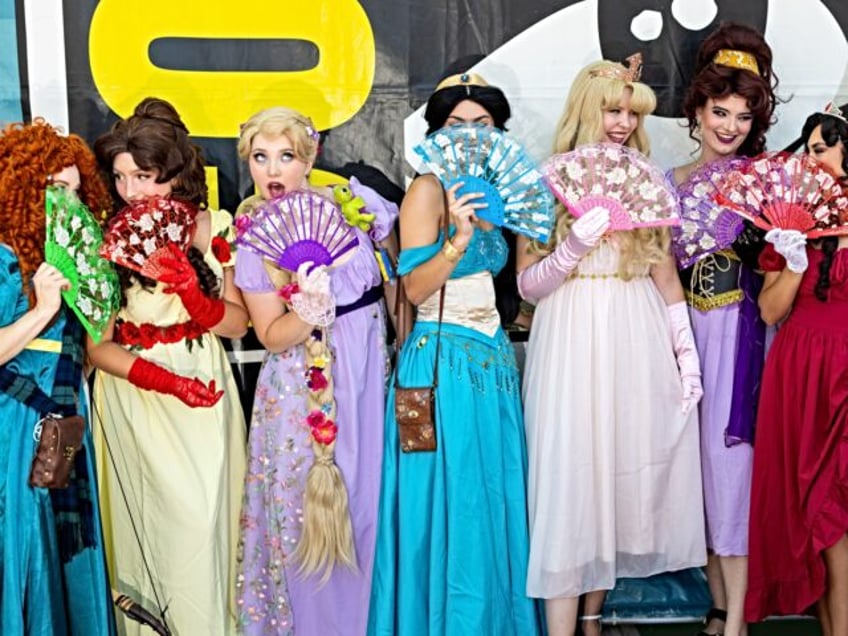 SAN DIEGO, CALIFORNIA - JULY 25: A collection of Disney princesses pose for photos, while