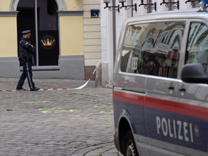 VIENNA, AUSTRIA - NOVEMBER 03: A policeman walks past markings on the ground showing one o