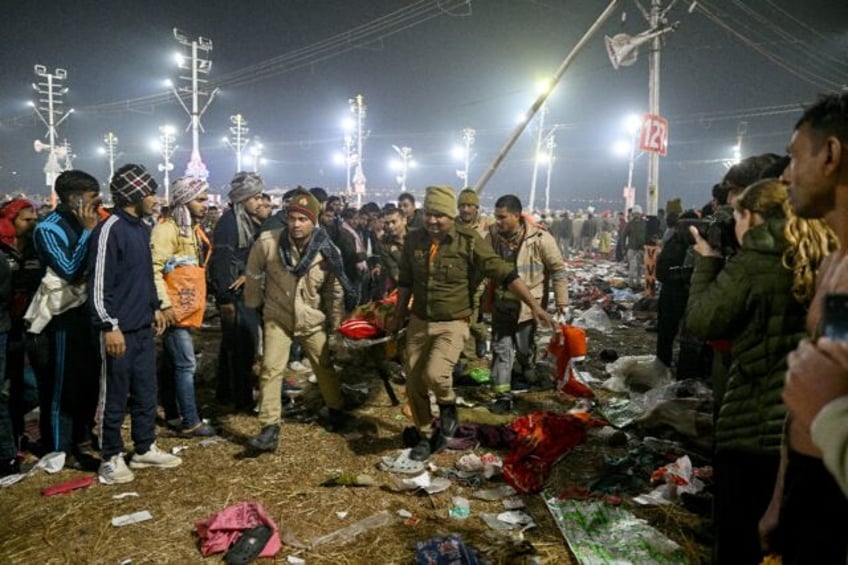 A pre-dawn stampede at a religious gathering in India killed at least 15 people, with many