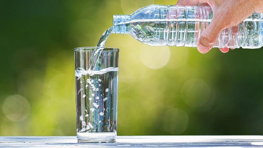 Water being poured into a cup