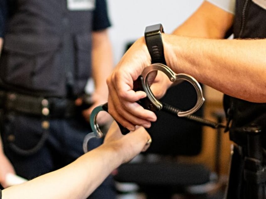 07.08.2018, Freiburg: The partner accused of child abuse sits in a room of the regional co