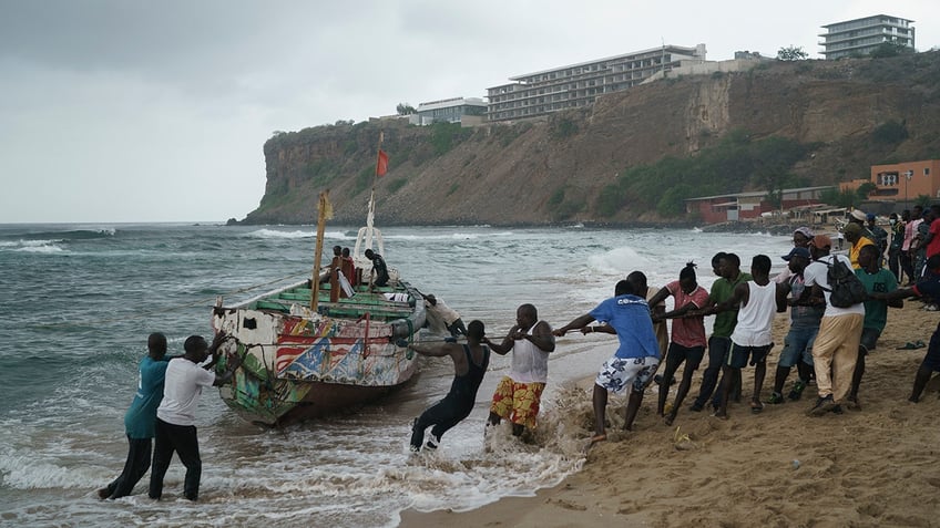 17 found dead after migrant boat capsizes off coast of senegals capital city