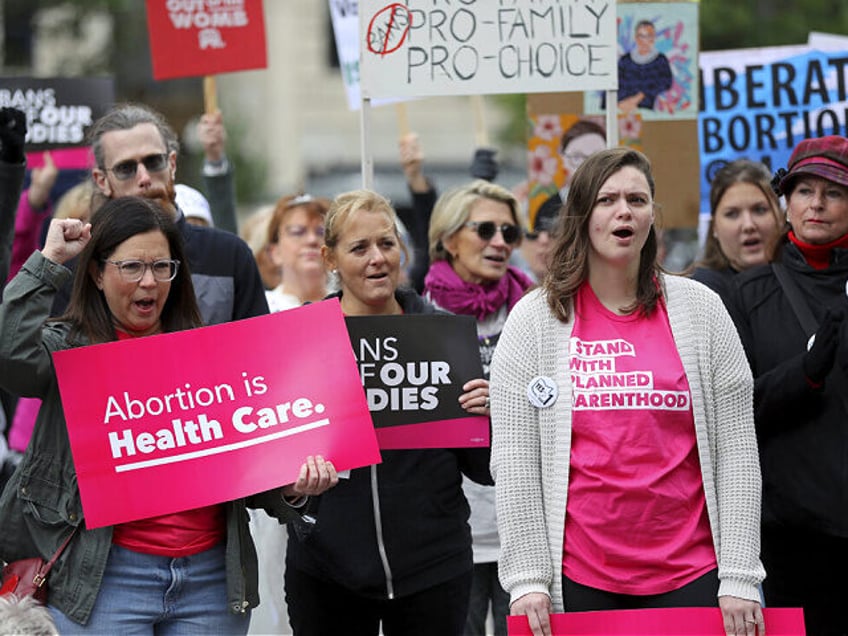 FILE - Supporters of Issue 1, the Right to Reproductive Freedom amendment, attend a rally