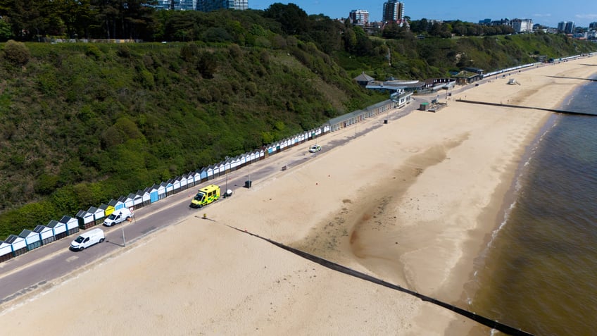 BOURNEMOUTH, ENGLAND - MAY 25: An aerial view of the closed and deserted beach at the scene of the double stabbing at Durley Chine Beach, on May 25, 2024 in Bournemouth, England. Dorset Police have launched a murder inquiry into the death of a woman stabbed on Friday night on Durley Chine Beach. Two women were found with stab wounds, one died at the scene. (Photo by Finnbarr Webster/Getty Images)