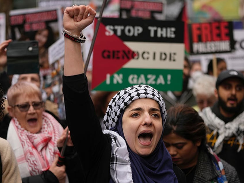 Pro-Palestinian protesters take part in a demonstration on Al Quds Day, in London, Friday,