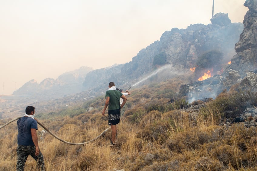 19000 people evacuated from greek island of rhodes as wildfires continue