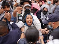 2 Columbia safety officers hurt as scores of pro-Palestinian protesters force way into library