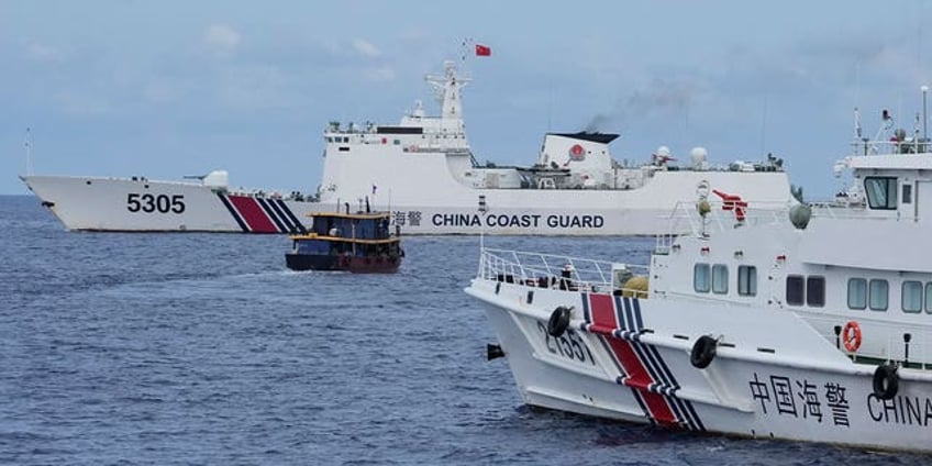 2 filipino boats deliver supplies to forces guarding a contested shoal breach chinese blockade along the way