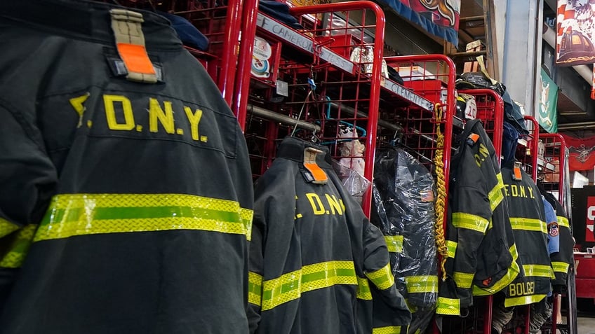 firefighter suits hanging in station