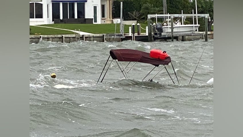 2 men rescued from sinking boat in florida waterway amid harsh weather police