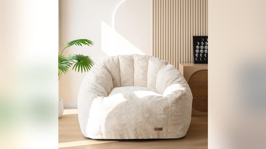 A cozy, plush chair, ideal for reading. 