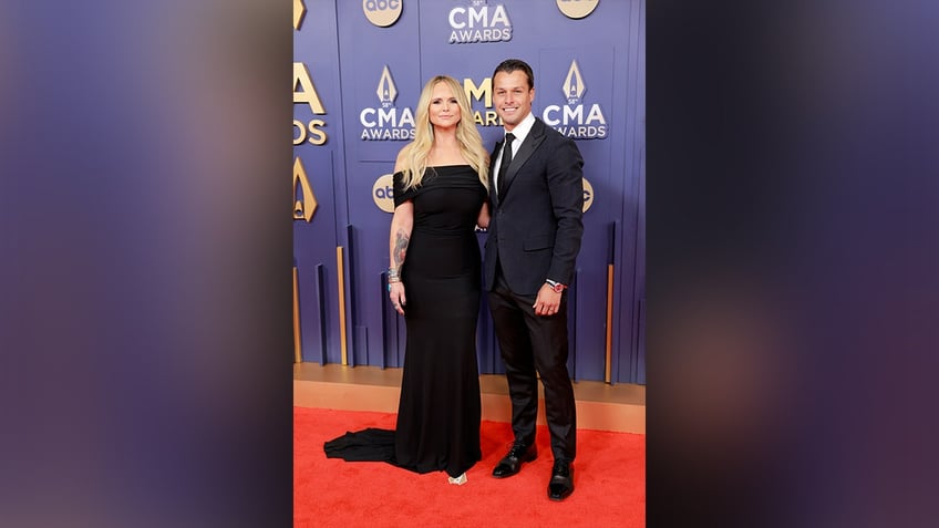 Miranda Lambert, who wore an off-the-shoulder black dress, walked the red carpet at the 2024 CMA Awards, with her husband, Brendan McLoughlin.