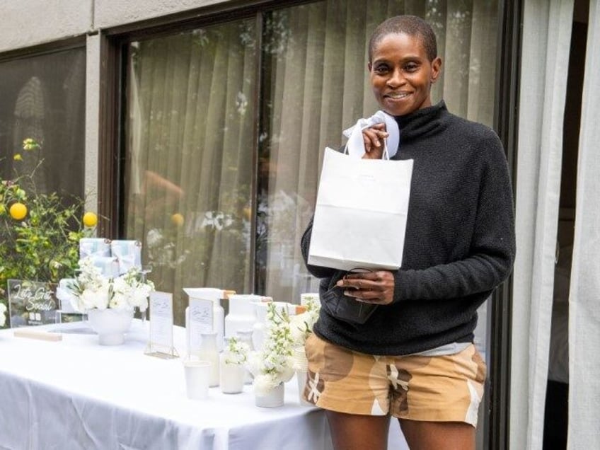 Actress Adina Porter poses at the Luxe Hotel as she picks up her gift bag at the drive-thr