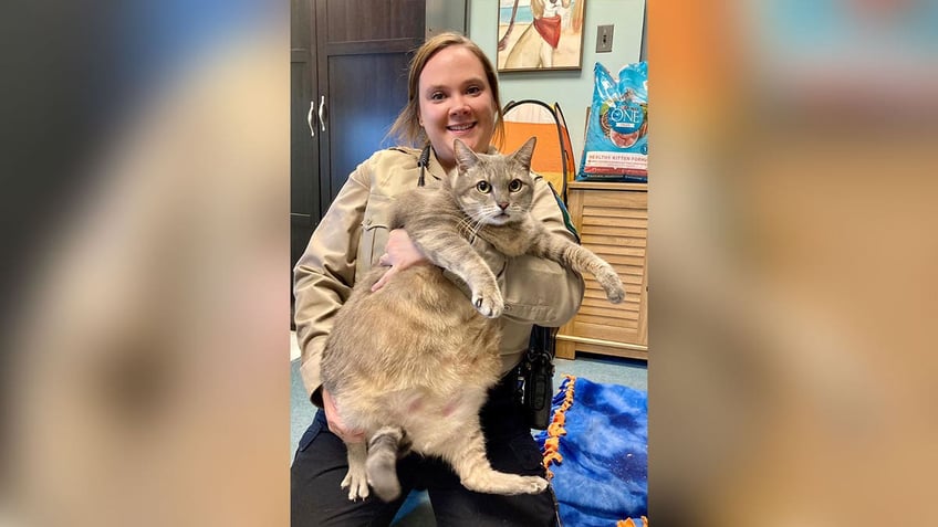 Frosty with animal shelter staffer