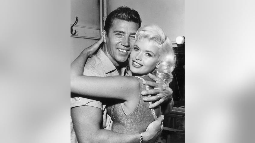 Mickey Hargitay hugging Jayne Mansfield.