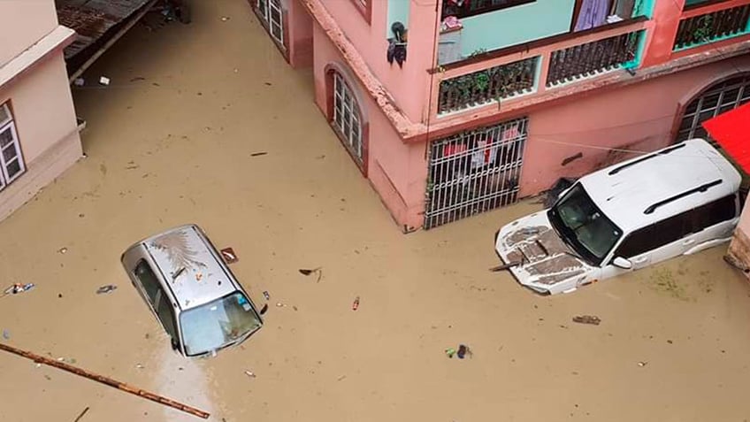 31 dead in indias himalayan northeast after lake bursts through major dam