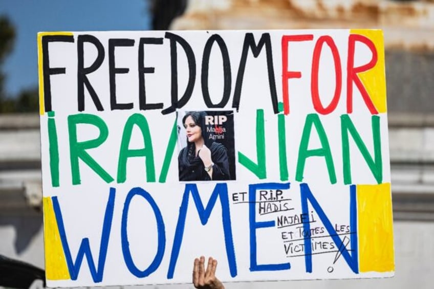 A placard carried during a march in Paris marking the second anniversary of the death in c