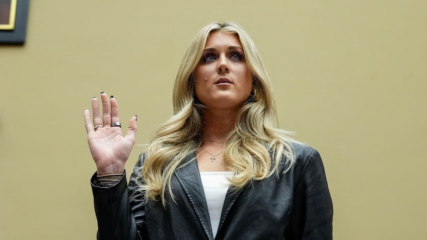 Riley Gaines is sworn in during a House Oversight Subcommittee on Health Care and Financial Services hearing on Capitol Hill December 5, 2023 in Washington, DC.