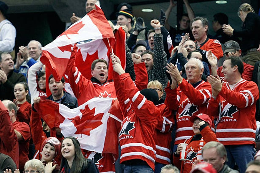 Canadian fans celebrate in the stands during the game against Team Canada and Team Czech Republic at the IIHF World Junior Championships at...