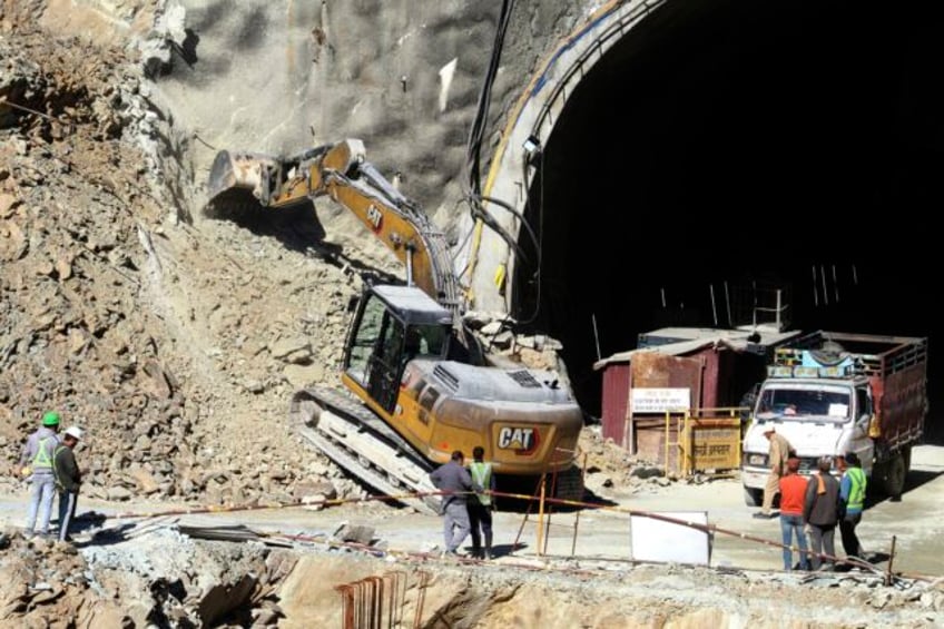 41 workers in india are stuck in a tunnel for an 8th day officials consider alternate rescue plans