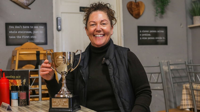 Hungry Hossee owner Shelaine Crabtree poses with her trophy for the cafe of the year.