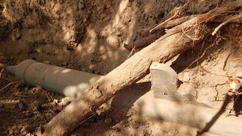 An ancient gun laying at an excavation site in Arizona