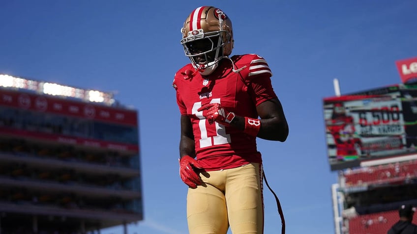 Brandon Aiyuk runs pregame