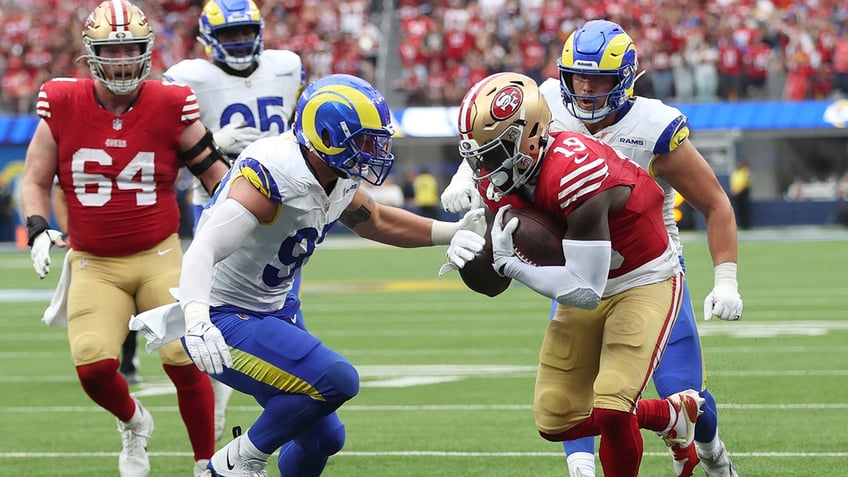 49ers force crucial turnovers to hold off rams to remain undefeated