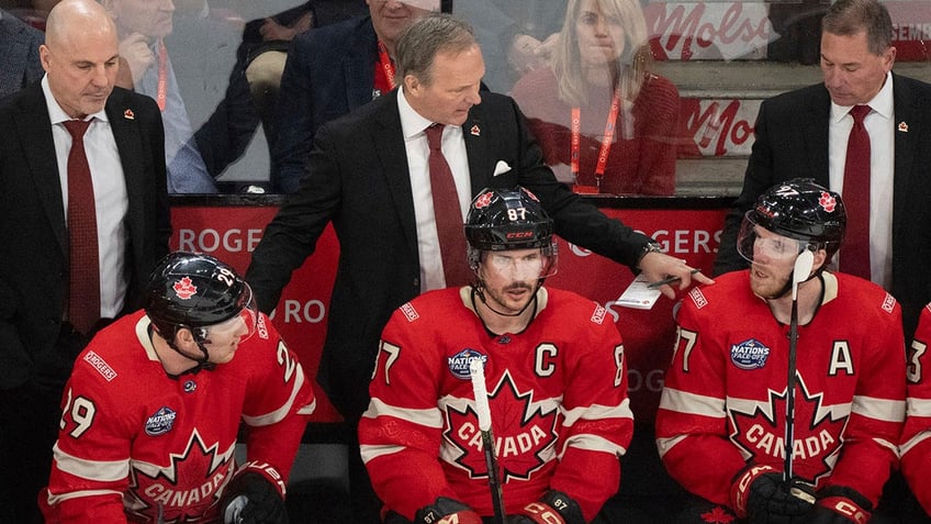 Jon Cooper talks to his team