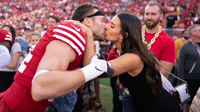 Kristin and Kyle Juszczyk kiss