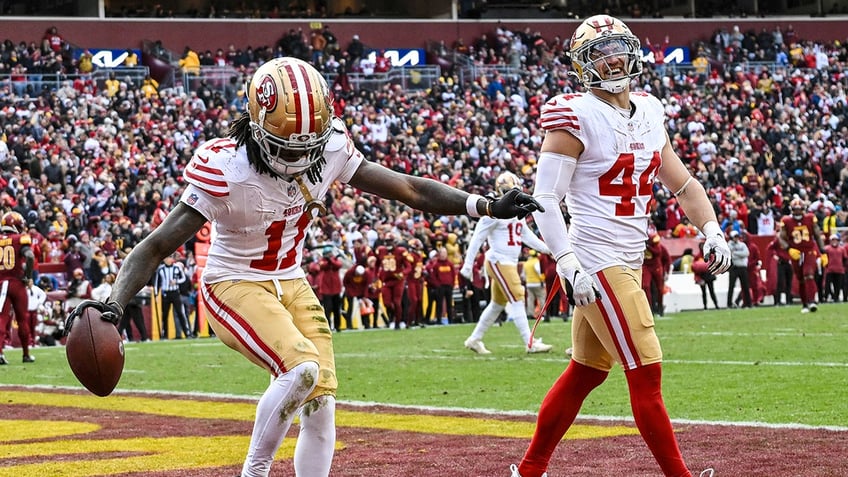 Brandon Aiyuk and Kyle Juszczyk celebrate