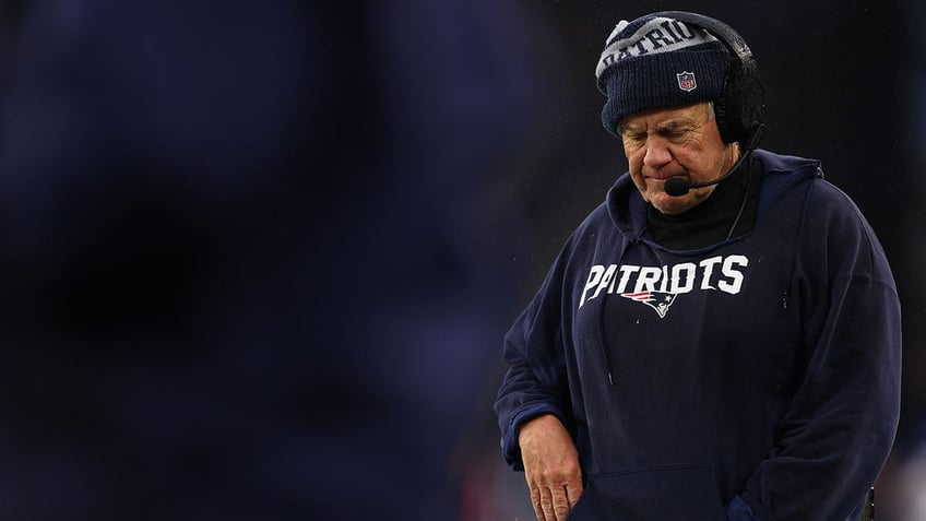 Bill Belichick looks down