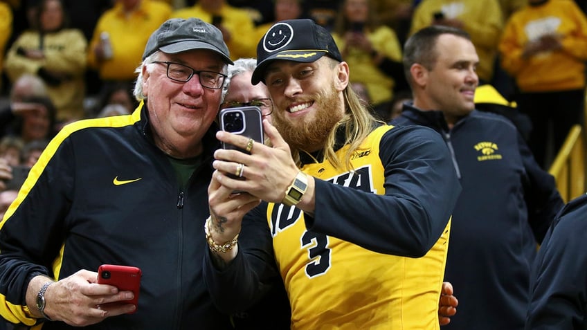 George Kittle takes picture with Iowa fan