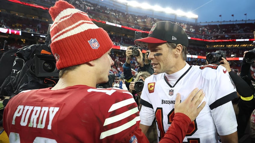 Brock Purdy talks with Tom Brady