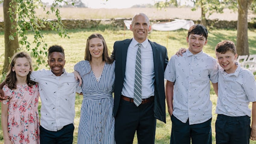 Jesse Bradley and his family, including several children. 