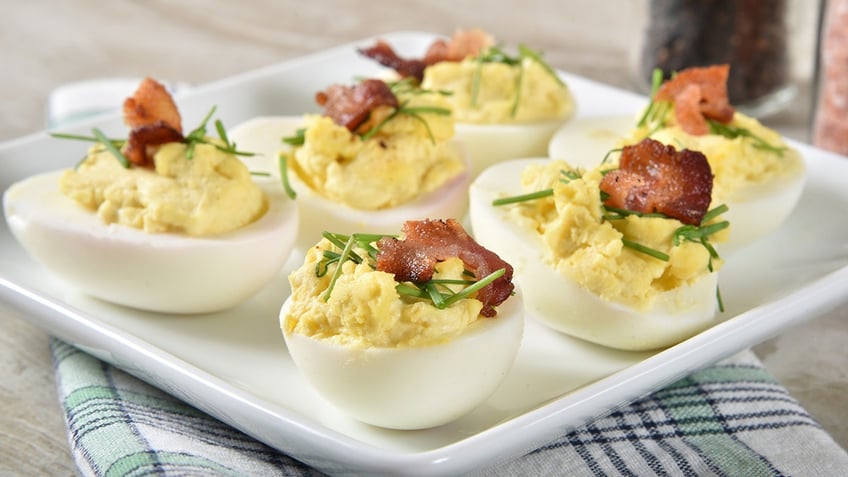 Deviled eggs with chives and bacon bits. 